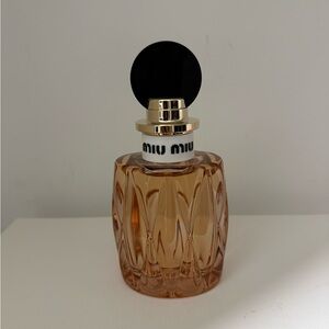 Miu Miu Fragrance with Black and Gold Accents